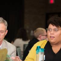 A women shares her views during the round table discussions.